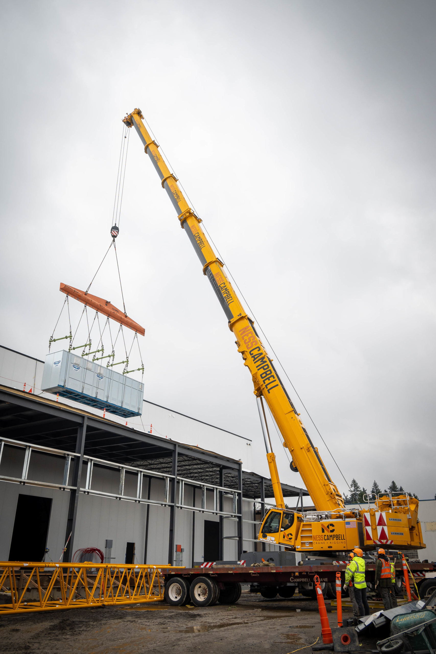 Jobsite picture from LGH and Ness Campbell case study, working on a chiller rack installation in Milwaukie, Oregon.